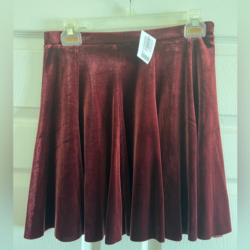 NWT burgundy velvet skirt, size M.
